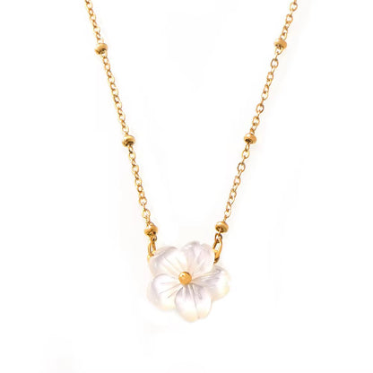 A delicate gold chain necklace featuring a central flower pendant made of iridescent white mother-of-pearl petals with a small gold center, shown against a plain white background.