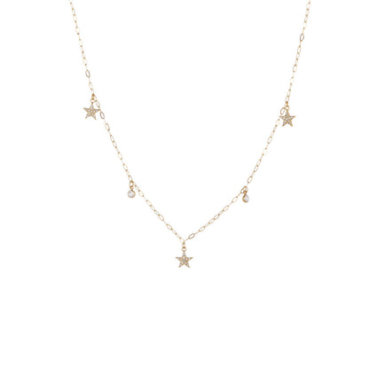 A delicate gold chain necklace featuring three small star charms, two tiny teardrop charms, and one larger star pendant at the center, displayed on a solid white background.