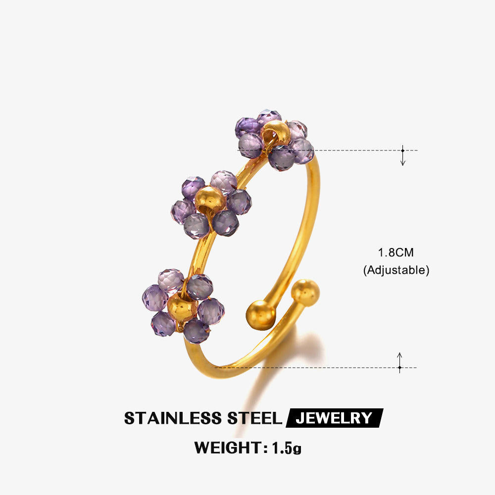 Gold and purple beaded ring with measurements on a white background