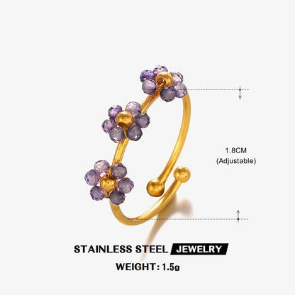 Gold and purple beaded ring with measurements on a white background