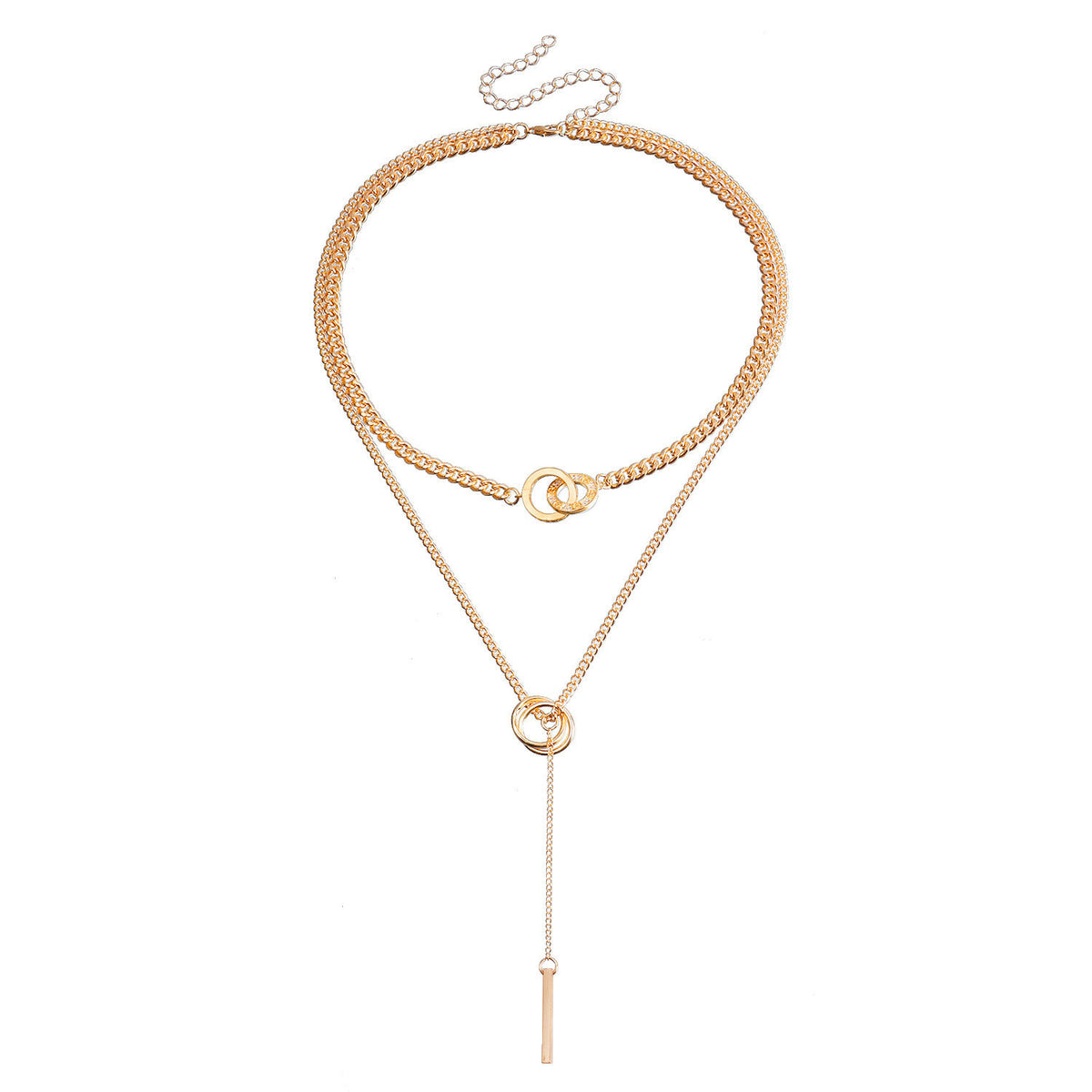 A gold-toned multi-layer necklace featuring a thick curb chain, a delicate chain with a small interlocking ring, and a long lariat drop ending in a flat bar, displayed on a solid white background.